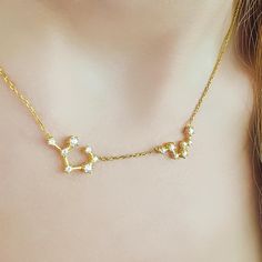 Channel the magic of the stars with our Zodiac Constellation Necklace in 14k Gold. This elegant necklace captures the beauty of your zodiac sign's constellation in a delicate design, adorned with sparkling stones that mimic the stars. A perfect piece for astrology lovers, this celestial necklace adds a unique and personal touch to your style, making it a thoughtful gift or a cherished addition to your jewelry collection. Materials: Meticulously crafted from high-quality 14k Gold, this constellat Zodiac Constellation Necklace, Astrology Jewelry, Celestial Necklace, Constellation Necklace, Pendant For Women, Zodiac Constellations, Elegant Necklace, Delicate Design, Necklace Dainty