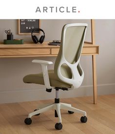 an office chair sitting on top of a hard wood floor next to a wooden desk