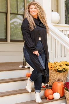 Wrap yourself in warmth with this unique black cardigan! This cutie has a cool design on the shoulders and has a fun split along the front and back! Style this over a tank or cami and skinnies for an easy to wear look! 73% Rayon, 22% Polyester, 5% Spandex Stretch Open Front Tops For Fall, Stretch Black Cardigan For Fall, Versatile Black Soft Knit Sweater, Stretch Cardigan For Day Out In Fall, Trendy Black Stretch Cardigan, Black Stretch Soft Knit Cardigan, Black Soft Knit Stretch Cardigan, Trendy Open Front Knit Top, Trendy Stretch Cardigan For Night Out