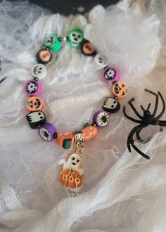 Halloween Colourful Beaded Bracelet - Boo Ghost Made with Clay Beads and Metal Charm. Fits Most Wrists, As Its A Pull on and No Clasp Bracelet. Comes with Organza Bag For Storage White Beaded Bracelets For Halloween, Handmade White Beaded Bracelets For Halloween, Halloween Novelty Beaded Bracelets With Round Beads, Halloween Novelty Multicolor Beaded Bracelets, Novelty Multicolor Beaded Bracelets For Halloween, Beaded Bracelets For Halloween Gift, Handmade Beaded Bracelets For Halloween, Handmade Multicolor Bracelets For Halloween, Halloween Multicolor Beaded Bracelets