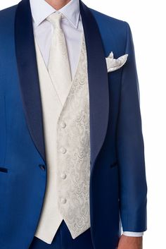 DESCRIPTION Royal Blue Tuxedo With Shawl Lapel Made in Pure New Wool from the Vitale Barberis Canonico Woollen Mill. One button peak satin lapel, welt satin pockets, tailored breast pocket, cuffs with uncut button holes with satin covered buttons, back vent, fully lined. Technical stretch lining in polyester comfort stretch. Classic trousers, no pleats, slim fit. Composition 100% Pure New Wool Fabric Super 110's Wool Season 4 Seasons Drop Regular - 7 Fit Slim Made in Italy Trousers bottom Unfini Royal Blue Tuxedo, Blue Tuxedo Jacket, Blue Tuxedo, Blue Tuxedos, Classic Trousers, Tuxedo Blazer, Button Holes, Tuxedo Jacket, 4 Seasons