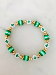 Super cute bracelet to wear as you celebrate St. Patrick's Day! Bracelet can be personalized upon request.  💟Choose your size and at checkout.  💟Please indicate the desired sizing within the customization section. Sizing length is as follows:  Women's small: 6.5 inches Women's medium: 7 inches Women's large: 7.5 inches Women's XL: 8 inches Children's 4-5 years old: 5.75 inches Children's 6-7 years old: 6 inches Children's 8-9 years old: 6.25 inches Children's 10-13 years old: 6-7 inches 💟List Shamrock Bracelet, Heishi Jewelry, Bracelet Styles, Bride Bracelet, Clay Bead Necklace, Lucky Charm Bracelet, Holiday Bracelets, Homemade Bracelets, Clay Bracelet