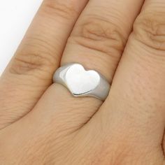 This lovely Heart signet ring is made from sterling (925) silver. It symbolizes love and affection and will make a great Valentine gift or Promise ring. It can also be worn as pinky ring. This ring was carved in jeweler's wax, then cast in sterling silver and hand-polished. Ships in a gift box. This ring is made to size, so please note that production may take up to two weeks. If you need it faster - please contact me before purchase to check availability. You can see my OOAK works on DeviantArt Promise Ring Silver, Heart Signet Ring, Gift For Valentine, Ring Heart, Zierlicher Ring, Heart Gifts, Ring Promise, Pinky Ring, Jewelry Ring