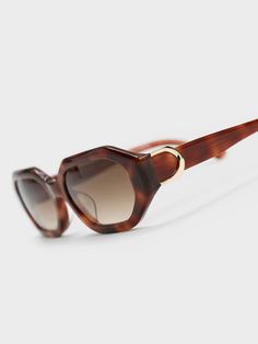 Featuring a classy tortoiseshell design, geometric lenses and a sleek silhouette, these Gabine sunglasses are the accessory you should be adding to your collection right now. The functional and chic tinted lenses add to the vintage allure that complements the overall aesthetic, while offering protection from harmful UV rays. The little Gabine buckles on the sides add a sophisticated touch of shine. Design Geometric, Charles Keith, Oval Sunglasses, Sunglasses & Glasses, Uv Rays, Tortoise Shell, The Vintage, Right Now, Lenses