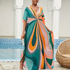 Bright Colorful Colorblock V-Neck Maxi Dress - Beach Cover-Up Dress Details Maxi Length / Batwing Sleeves / V-Neckline / Oversized Fit Fabric 100% Viscose Color Multicolor Summer Multicolor V-neck Maxi Dress, Multicolor Flowy V-neck Maxi Dress, Colorful V-neck Beach Dress, Colorful V-neck Vacation Dress, Chic Multicolor Maxi Dress For Beach Cover-up, Orange V-neck Maxi Dress For Beach, Orange V-neck Summer Maxi Dress, Orange V-neck Maxi Dress For Vacation, Retro V-neck Maxi Dress For Summer