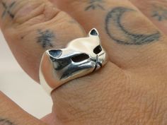 Vintage sterling silver kitty cat ring this ring is a US size 7 weight 3.29 grams  band width3mm at the back of the ring 11.5mm at the front of the ring this ring is marked 925 on the inner band PLEASE BE ADVISED SOME PHOTOS ARE CLOSEUPS TO SHOW DETAIL, PLEASE READ FULL DESCRIPTION FOR BETTER UNDERSTANDING OF SIZE.  This item is preloved and Antique/Vintage. This means it may have signs of wear and use and is offered as is.  You will receive the exact item shown in the photos. There may be sligh Silver Cat Design Promise Ring, Silver Ring With Cat Design For Anniversary, Silver Promise Ring With Cat Design, Silver Anniversary Ring With Cat Design, Silver Cat Design Ring, Sterling Silver Cat Design Rings For Anniversary, Anniversary Sterling Silver Rings With Cat Design, Adjustable Sterling Silver Cat Design Rings, Cat Ring