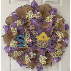 a purple and tan wreath with letters on it