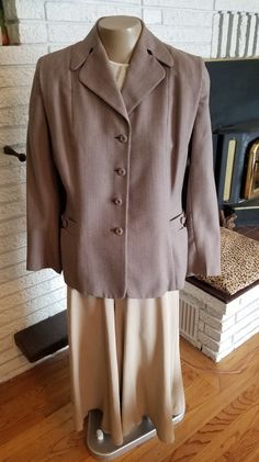 "1950's Wool Weave brown and tan Tailored Suit Jacket. Ornate collar cutout detail as well as the Button strap over hips pockets! Covered buttons, Crepe' lining. 15.5 across shoulders 23\" sleeve length 19\" across chest 17\" across waist 26\" jacket length Great condition Size 12/14" Black Lace Party Dress, Lace Party Dresses, Guest Attire, Wedding Attire Guest, Tailored Suits, Black Cocktail Dress, Wool Blazer, 50s Fashion, Wool Jacket