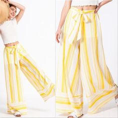 Tie Front Yellow / white striped palazzo pants True To Size Material:100% polyester partially lined Model is 5' 9" tall, 26" Waist and 35" Hips and wearing size Small Cheap Yellow Bottoms For Beach Party, Luxury Yellow Wide Leg Pants For Women, Luxury Yellow Pants For Formal Occasions, Cheap Yellow Wide-leg Pants, Luxury Yellow Palazzo Set For Summer, Luxury Casual Yellow Bottoms, Yellow Retro Pants Affordable, Cheap Retro Yellow Pants, Goucho Pants