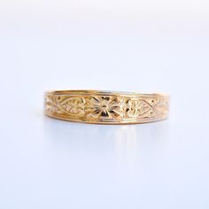 An antique mold was utilized in this faithful reproduction wedding band. Motif is a stylized daisy center flanked by tiny hearts and vines.  Other information: Recycled 14 karat yellow gold Finger size US 7 1/4* Made from vintage methods and instruments in recycled gold by Hugo Kohl and team in his Harrisonburg, VA st Enamel Wedding Band, Art Nouveau Wedding Band, Art Nouveau Weddings, Belle Epoch, Art Deco Wedding Band, Tiny Heart, Recycled Gold, Gold Bands, Handcrafted Jewelry