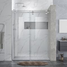 a bathroom with marble walls and flooring, including a walk in shower next to a sink