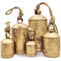 an assortment of old brass bells with rope