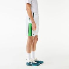 These diamond taffeta shorts from Lacoste, sporting experts since 1933, are designed to offer full freedom of movement match after match. Made from lightweight fabric with a loose cut for maximum comfort. The colorful side stripes create a modern feel, while the jersey lining is there to keep you covered. Sporty Tennis Shorts With Elastic Waistband, White Tennis Shorts Athleisure, White Shorts For Tennis Athleisure, White Athleisure Tennis Shorts, White Sportswear Tennis Bottoms, White Training Bottoms With Elastic Side Panels, White Moisture-wicking Nylon Shorts, White Tennis Sportswear Bottoms, White Sporty Tennis Bottoms