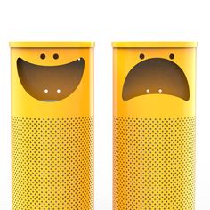 two yellow trash cans with faces painted on the sides and eyes drawn on each side