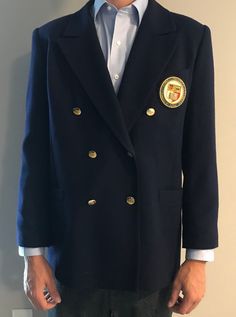 Vintage large navy double-breasted blue blazer in excellent condition. Cotton traditional, sophisticated garment.  Embroidered with ornate Cornell University badge - finely hand stitched with luxury gold bullion wire, silks and cottons. Golden engraved buttons.  Large: 41-43 inch chest Dry clean only Formal Blue Embroidered Outerwear, Vintage Embroidered Blazer For Formal Occasions, Navy Formal Uniform Outerwear, Uniform Style Double-breasted Formal Blazer, Ithaca Ny, Cornell University, Gold Bullion, Double Breasted Suit Jacket, Hand Stitched