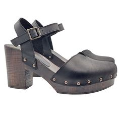 Dutch-style clogs are very trendy, handcrafted in a mix of retro elegance and modern femininity, perfect to wear at any time of the day, for those who love comfort but always with a touch of glamour. Women's clogs with brown wood effect base Upper in black leather, heart shape Closed rounded toe Adjustable ankle strap Heel height 9.5 cm + 3 cm plateau Made entirely by specialized Italian personnel Handcrafted products using the best materials. BEFORE PURCHASING DO NOT FORGET TO CHECK THE SIZE! Chic Clogs With 4-inch Block Heel, Chic Clogs With 4-inch Heel And Open Back, Chic Clogs With 4-inch Heel And Round Toe, Chic Leather Clogs With Ankle Strap, Chic Clogs With Wooden Open Heel, Chic Clogs With Wooden Heel And Ankle Strap, Leather Clogs With 4-inch Block Heel, Chic High Heel Clogs With Deep Heel Cup, Black Slingback Sandals With Deep Heel Cup