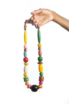 "Stunning unique, hand painted chunky wood bead necklace.  The necklace is designed using hand painted beads, sourced from Barcelona Spain.  Featuring colorful beads and an art deco design, this necklace is the perfect gift for the favorite woman on your gift list.   *Ready to ship *Bold and beautiful *Length: 15\" Image colors may appear brighter/darker on your computer monitor depending on resolution. **Please read our shipping and other shop policies before placing an order.  **Special offer: Colorful Wooden Beaded Necklaces, Multicolor Necklaces With Wooden Beads, Artisan Multicolor Wooden Beaded Necklaces, Unique Multicolor Wooden Beads Necklaces, Artisan Multicolor Wooden Beads Necklace, Multicolor Hand Painted Beaded Bohemian Necklace, Unique Multicolor Wooden Beads, Multicolor Wooden Beads, Multicolor Hand Painted Bohemian Beaded Necklace