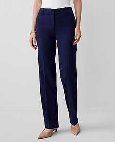 Elevate your wardrobe with the Ann Taylor Mid Rise Straight Pant, a perfect blend of sophistication and comfort. These navy pants are tailored to flatter with a straight leg design that skims the legs for a sleek, timeless look.

- **Size:** Regular 6
- **Color:** Navy
- **Gender:** Female
- **Material:** 73% Polyester, 24% Rayon, 3% Spandex
- **Fit:** Tailored and fitted
- **Rise:** Mid rise, sits 2 1/4" below natural waist
- **Length:** Full length; 31" inseam with 16 1/2" leg opening
- **Clos Straight Fitted Office Bottoms, Fitted Straight Bottoms For Office, Tailored Straight Office Pants, Tailored Straight Pants For Office, Fitted Straight Bottoms For Formal Occasions, Elegant Straight Pants For Business, Elegant Straight Leg Career Pants, Fitted Straight Bottoms For Workwear, Elegant Career Pants With Straight Leg