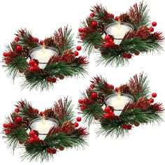 three christmas wreaths with candles and berries on them are arranged in the shape of an ornament