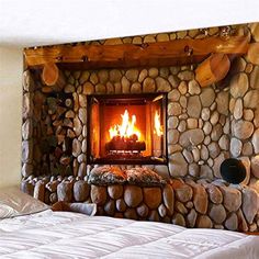 a bedroom with a bed and a fireplace in the wall next to it's headboard