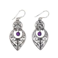 These ornate earrings by Komang Suastra evoke the grandeur of Java's Majapahit era. Crafted with elaborate openwork the sterling silver earrings sparkle with the beauty of amethyst. .925 Sterling silver Traditional Sterling Silver Chandelier Earrings With Intricate Design, Ornate Teardrop Jewelry With Intricate Design, Ornate Drop Earrings With Intricate Design, Sterling Silver Hallmarked Chandelier Earrings, Ornate Hallmarked Dangle Chandelier Earrings, Hallmarked Sterling Silver Chandelier Earrings, Ornate Hallmarked Chandelier Dangle Earrings, Sterling Silver Filigree Chandelier Earrings For Formal Occasions, Sterling Silver Filigree Chandelier Earrings For Formal Events