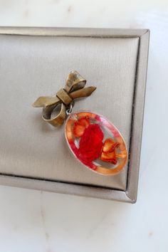 Vintage Resin Red Rose Bow Brooch. Length: 1 3/4" Width: 7/8" Vintage condition! please zoom in. Back to the shop: https://www.etsy.com/shop/SusVintage?ref=hdr_shop_menu If you have any questions feel free to contact me. Thank you!! Vintage Red Pins For Gifts, Vintage Red Pins For Gift, Vintage Red Pins As Gift, Handmade Vintage Red Brooches, Red Brooch Jewelry For Valentine's Day, Red Valentine's Day Brooch, Red Brooch Pins For Valentine's Day, Red Brooches For Valentine's Day, Red Brooch For Anniversary On Valentine's Day