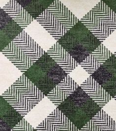 a green and white checkered rug on the floor