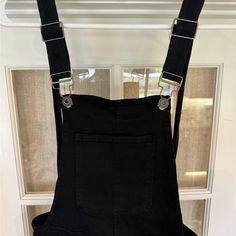 Never Worn. Black Cotton Overalls With Suspenders, Black High Waist Jumpsuits And Rompers For Spring, Black Overalls With Suspenders, Chic Black Overalls For Spring, Chic Black Cotton Jumpsuits And Rompers, Black Bottoms Overalls For Night Out, Black Overall Jumpsuits And Rompers With Pockets, Black Summer Overalls For Workwear, Black Jumpsuits And Rompers With Pockets For Fall