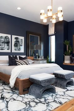 a large bedroom with blue walls and white carpeted flooring is pictured in this image