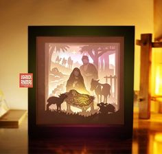 a paper cut nativity scene with the birth of jesus