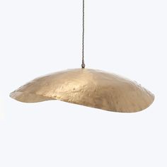 a large metal light hanging from a chain on a white background with no one in it