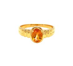 This beautiful ring is crafted from 14k yellow gold, and is adorned with a sparkling oval Citrine measuring 7mm x 5mm for a total weight of one carat, atop a ribbed shank. Both shoulders of the ring feature a ribbed design for an extra touch of sophistication. The face of the ring measures 8.8 mm with a rise of 5.7 mm off the finger's surfaceThe ring is a size 7.   Citrine is the birthstone for November babies and this ring makes a fantastic gift! Metal: 14k Yellow Gold Gemstone - Citrine Gemstone Size - 7 x 5 mm Cut: Oval Total weight: 1 carat Finger size  - 7 Classic Yellow Gold Sapphire Ring Oval Cabochon, Oval Gold Topaz Ring With Diamond Cut, Oval Yellow Gold Topaz Ring For Formal Occasions, Formal Oval Yellow Gold Topaz Ring, Gold Sapphire Ring With Oval Shape, Gold Oval Topaz Ring With Center Stone, Oval Gold Sapphire Ring, Oval Gold Topaz Ring With Polished Finish, Yellow Gold Solitaire Ring With Oval Cabochon