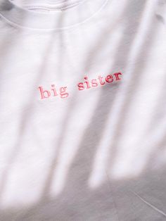 Big Sister Embroidered Toddler T-Shirt This design comes in a White T-Shirt with Dusty Pink Color thread If you would like a different color thread please message me to confirm color.  Shipping is 7-10 business days Dusty Pink Color, Baby Pregnancy, Sister Shirt, Big Sister Shirt, Big Sis, Sister Shirts, Embroidered Tshirt, Toddler Tees, San Antonio Tx