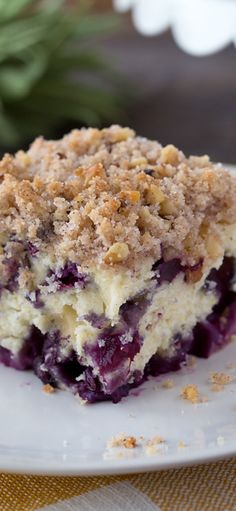 a piece of blueberry crumb cake on a plate