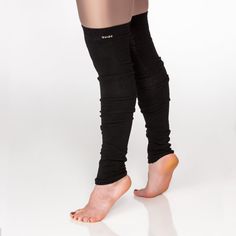 Originally, leg warmers were worn by dancers to keep their muscles from cramping after stretching, but the 80's changed all that! It didn't take long for this trend to gain international popularity as fashion over function. Wear these low and bunched or thigh high. Content: 42% COOLMAX® polyester, 16% polyester, 38% cotton, 2% LYCRA® spandex, 4% other fiber exclusive of elastic Fitted Footless Dance Legwear, Fitted Footless Dancewear Legwear, Fitted Black Bottoms For Barre, Micro-elastic Footless Legwear For Dance, Flexible Footless Winter Leg Warmers, Footless Winter Leg Warmers, Fitted Thigh High Black Leg Warmers, Trendy Fitted Footless Leg Warmers, Black Stretch Bottoms For Barre