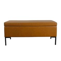 a tan leather bench with black legs