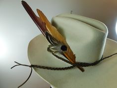 "Large hat feather spike with braided leather band. This cowboy hat band is constructed of Primary Brown Duck Wing feathers and natural Partridge Small Plumage, accented with a round 1/2\" geode black accent.  Perfect rustic, rural feather look for a cowboy hat. Durable, removable, and reusable! Great gift, and adjusts for any hat. Custom orders are my delight! I can customize any design (any number) just for you, or create something unique for your event... Just Give me a Convo. Together we can Rustic Adjustable Hat For Hunting, Vintage Feather Hat Bands For Festival, Adjustable Feather Hat Bands For Western-themed Events, Adjustable Feather Hats For Country Events, Adjustable Western Hunting Hats, Adjustable Fedora Hat Bands For Hunting, Western Adjustable Hat Bands With Feathers, Adjustable Country Style Felt Hat For Hunting, Adjustable Country Style Fedora For Hunting