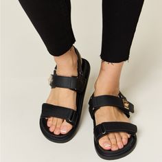 Wild Diva Velcro Double Strap Slingback Sandals New With Box Color Black Step Up Your Summer Shoe Game With These Trendy Velcro Double Strap Slingback Sandals. The Double Strap Design With Velcro Closure Offers Both Style And Convenience, Making Them Easy To Adjust For The Perfect Fit. These Slingback Sandals Are Versatile And Perfect For Various Occasions, From Casual Outings To Summer Parties. The Supportive Yet Comfortable Design Ensures You Can Wear Them All Day Long Without Sacrificing Styl Synthetic Flat Heel Slingback Sandals With Buckle, Flat Heel Synthetic Slingback Sandals With Buckle, Black Synthetic Footbed Sandals With Adjustable Straps, Black Strap Footbed Sandals For Summer, Black Strap Slingback Sandals For Spring, Black Slingback Sandals With Strap For Spring, Spring Black Slingback Sandals With Strap, Black Slingback Sandals With Textured Footbed, Black Footbed Sandals With Adjustable Straps