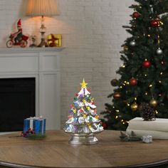 a small christmas tree sitting on top of a wooden table