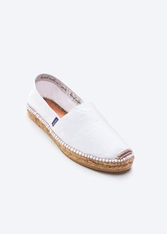 The perfect blend of comfort and versatility, these Barceloneta flat canvas espadrilles are just what you've always wished for. The perfect style partner for all your casual combos, these will soon become your best travel buddies. Lightweight, breathable and small enough to slip into your weekend bag, once you put them on you'll never want to take them off. TOP TIP: STYLE Lightweight and compact, once you put on these compact casuals, you'll never want to take them off. Slip on a pair of our bea White Slip-ons With Rubber Sole For Summer, White Casual Slip-ons For Beach, Summer Beach Canvas Slip-ons, White Casual Beach Slip-ons, White Canvas Espadrilles For Vacation, White Cotton Espadrilles With Round Toe, White Canvas Slip-ons For Summer, Summer Cotton Slip-ons With Rubber Sole, White Textile Canvas Shoes For Summer