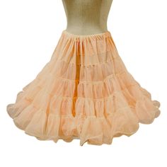 Vintage square dance petticoat from the 70s. This pale peach crinoline is knee-length and has 2 layers of crisp nylon with ruffled trim. There's quite a bit of fabric here for lots of volume and the waist is elasticized.  Condition is good overall with the only notable issue being the waistband has a 1" open gap which shows the elastic within.  Size Medium - Sam's brand - Made in USA - Nylon 26" to 34" (laid flat to max comfort stretch) - 22" length (approx) For more vintage clothing, please vis Square Dance, Pale Peach, Square Dancing, The 70s, Petticoat, Vintage Clothing, Knee Length, Vintage Outfits, Gap