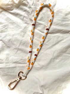 pumpkin keychain beaded lanyard wristlet Beaded Keychains Native American, Pumpkin Keychain, Beaded Wristlet Keychain, Lanyard Crafts, Wristlet Patterns, Keychain Beaded, Beaded Wristlet, Handmade Wristlet, Pumpkin Bead