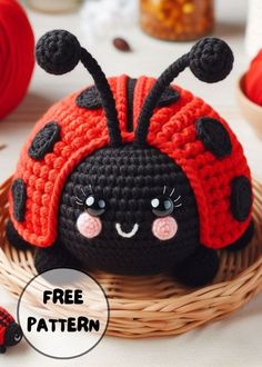 a crocheted ladybug sitting on top of a basket