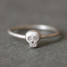 "Please read my shop announcement for delivery time. If you need it by a specific date, please contact me first. Thank you! Gift packaging as well as a gift note is available at checkout. If you want to include a note, add your message in the note box during checkout. Small skull ring in sterling silver with diamond eyes on a thin round shank. The skull measures approx. 1/4\" high. This ring is offered without the diamond eyes, in 14k and silver, and all 14k in separate listings. If you have any Baby Skull, Diamond Skull, Small Skull, Diamond Eyes, Skull Jewelry, A Skull, Skull Ring, Skull And Bones, Silver Diamonds