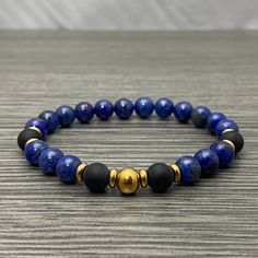 This stretch bracelet is made of 8mm round Lapis Lazuli gemstone beads, 8mm matte black onyx gemstone beads, with round 8mm gold plated stainless steel and rondel beads. This bracelet will fit almost any wrist, but let me know if you have a smaller or larger than average wrist or if you need a specific size. Everyday Quotes, Men's Bracelets, Lapis Lazuli Gemstone, Bracelet Men, Onyx Gemstone, Bracelet Ideas, Black Bracelets, Mens Beaded Bracelets, Diy Bracelet