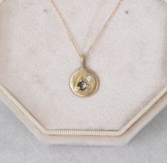 The stunning Abigail necklace features a 3mm chocolate diamond with a smaller, 2mm white diamond in a flush setting in solid gold. The offset stones combined with the variety of settings makes her unique, yet ever so gorgeous. Abigail is about 12mm across, in total. A true beauty!  Paired with your choice of a 16inch chain or an 18inch chain solid gold chain.   Handmade in my studio. Brown Diamond Necklace, Dainty Rose Cut Diamond Round Pendant Jewelry, Oval Diamond Pendant Necklace With Rose Cut, Minimalist Sterling Silver Necklace With Rose Cut Diamonds, Fine Jewelry Rose Cut Diamond Round Pendant Necklace, Diamond White Birthstone Necklace With Round Pendant, Gift Jewelry With Rose Cut Diamonds In Recycled Gold, Minimalist Rose Cut Diamond Necklaces For Anniversary, Diamond White Rose Cut Diamond Pendant