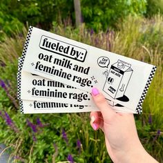 someone is holding up two stickers that say fueled by oat milk and feminine rage