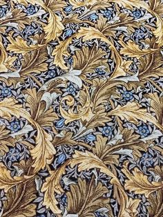 an intricately designed fabric with gold and blue flowers