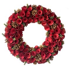 a christmas wreath with pine cones and red flowers