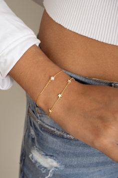 Such a cute star bracelet, featuring 6 star charms. This bracelet is great for stacking or on its own! Also makes for a special gift! THICK plating of 14k Gold or Rhodium over 925 Sterling Silver Available in 6.25" or 6.75" + .5" Ext Chain Lobster clasp closure Nickel-free & Hypoallergenic Dainty Adjustable Chain Bracelet With Star Charm, Adjustable Star Charm Chain Bracelet, Dainty Star-shaped Bracelets For Everyday Wear, Everyday Star Charm Bracelet, Adjustable Chain Bracelet With Star Charm As Gift, Dainty Bracelets With Star Charm For Gift, Dainty Bracelets With Star Charm As Gift, Dainty Star-shaped Bracelets For Gifts, Gold Star Bracelets For Everyday